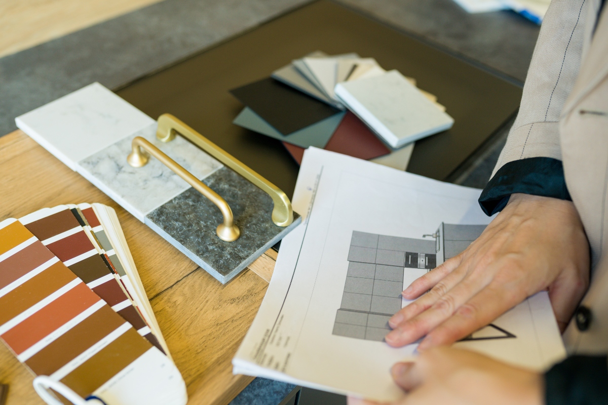 Person choosing kitchen fixtures and colors for remodel